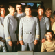 They used up all the color on the poster, so the Enterprise crew had to make do with these outfits instead.